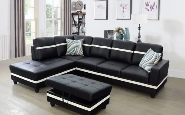 Black and white leather modern style sectional couch and ottoman