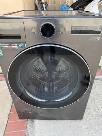 LG WM6700HBA high capacity washer ,dented on button front by the filte