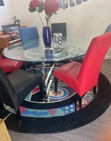 Like new,6 leather chairs and glass table
