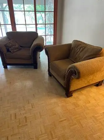 Two Oversized Chairs with Matching Tufted Ottoman