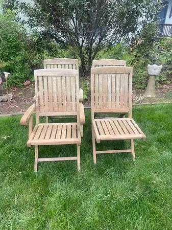 Set of four teak folding patio chairs