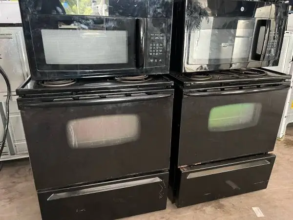 Black coil top stove with microwave