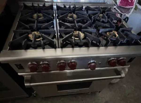 Wolf Stainless Steel 36” Wide Gas Range/Subzero Fridge 36” Wide