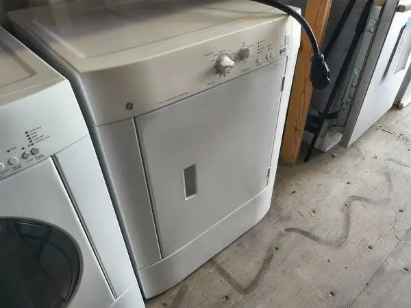 White GE Front Load 5.8 Cu Ft Electric Dryer Model # DSXH47EG1WW Used