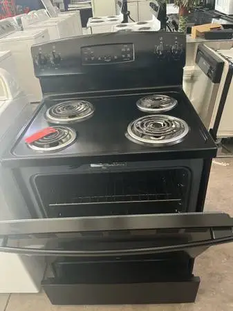 Black GE coil top stove