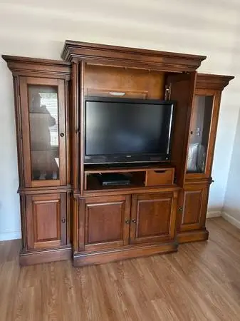 Tv cabinet with lighted side cabinets