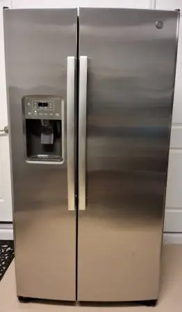 Stainless Steel GE refrigerator/freezer with Ice maker