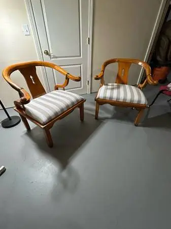Two beautiful hand carved wooden chairs . Real massive wood with metal accents