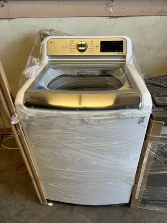 New Out Box LG 5.5 cu ft High Efficiency Smart Top Load Washer