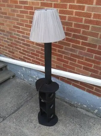 Fine crafted Wooden floor lamp. Height is 57.SEE MAP