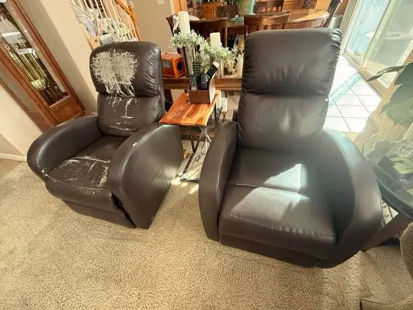 Two faux leather recliner chairs