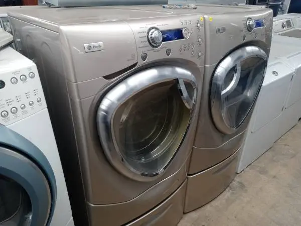 ★GE Profile tan front load washer and dryer set on pedestals