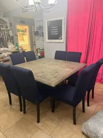 Solid wood farm style table with 8 chairs