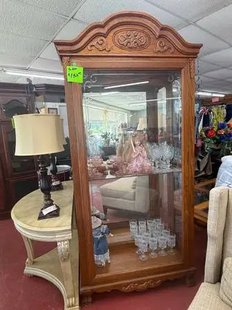 Light oak curio cabinet