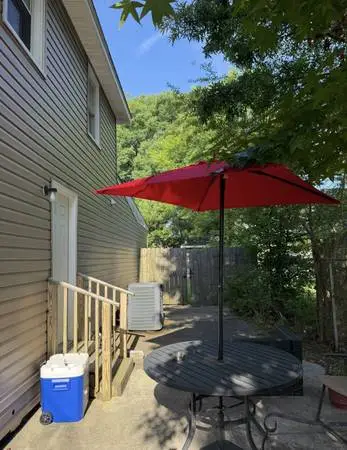 Outdoor dining table with umbrella
