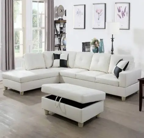 White leather sectional couch and storage ottoman