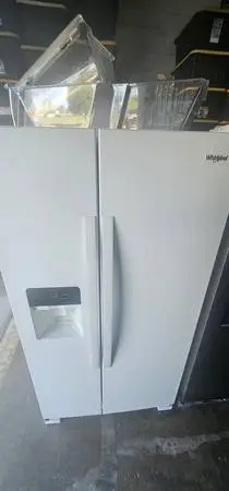 Newer model Whirlpool gloss white side by side refrigerator