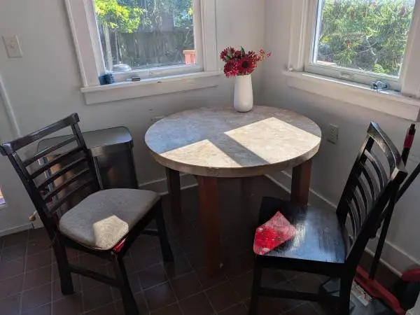 Round Marble Table, with 2 wood chairs.
