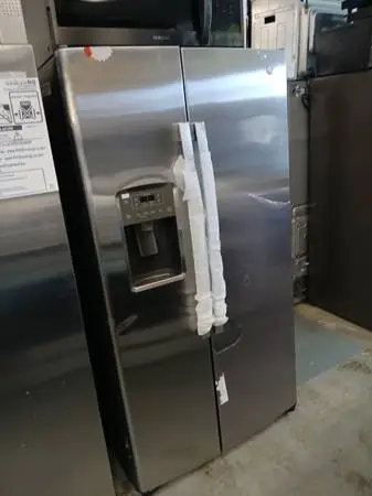 New ! Ge stainless steel side by side refrigerator small dent