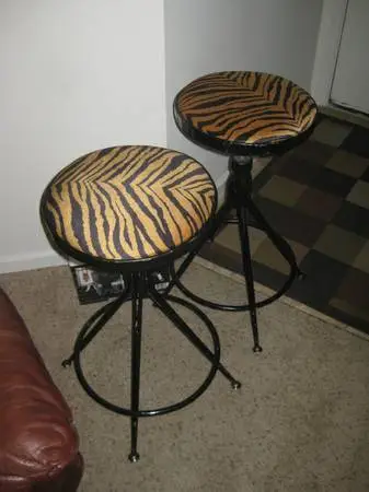 Two Swivel Steel Tiger Print Bar Stools