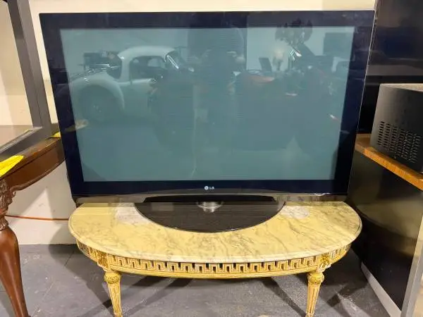 LG plasma tv and marble coffee table setup