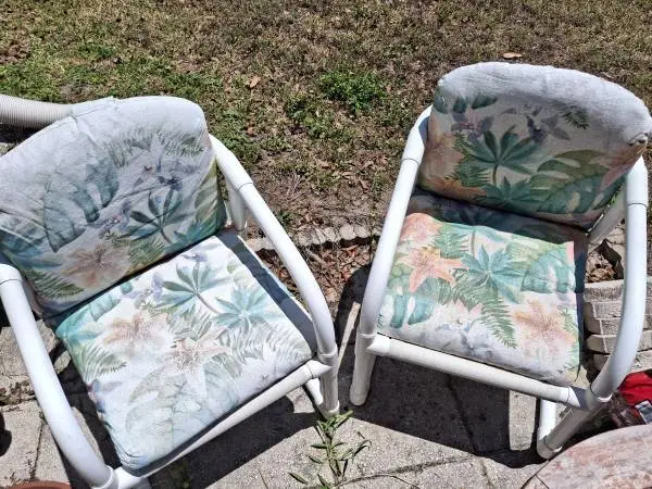 Two pvc lawn chairs with cushions great condition. $10 ea. or 2 for