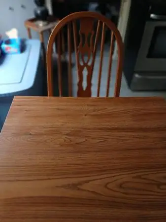 Wooden kitchen table and both ends fold out and comes with 2 chairs