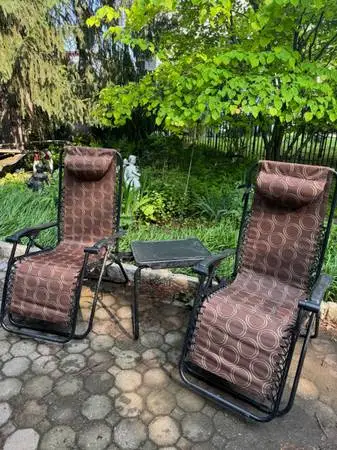 Pair of zero gravity chairs and foldable table
