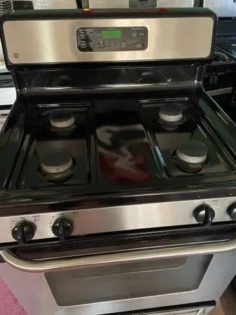 #### GE STOVE BLACK N STAINLESS WITH SELF CLEANING ###