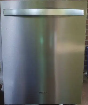 GE stainless steel dishwasher with hidden controls