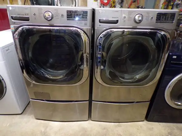 Stainless 5.0 cf LG FRONT LOAD WASHER&DRYER/ pedestals