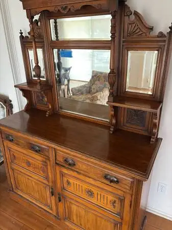 Beautiful  vintage cabinet with bevelled mirrors and wood carving