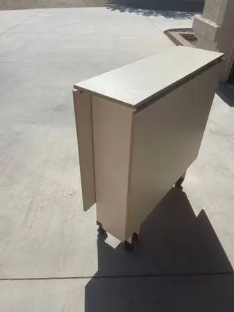 Folding craft table on wheels