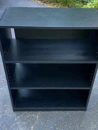 Small Black Bookcase And A Small Black Storage Cabinet