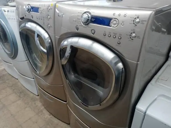 ★GE Profile tan front load washer and dryer set on pedestals