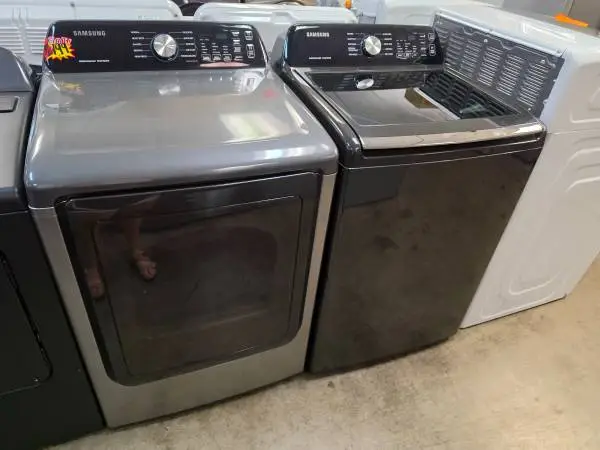 Samsung black active water jet top load washer and gas dryer