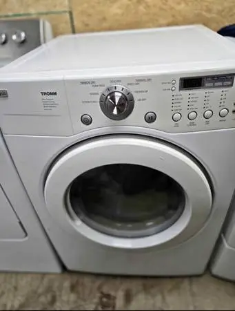 white LG Tromm front-load electric dryer