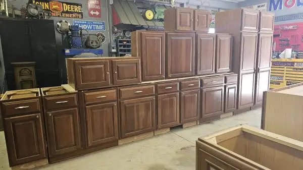 Large set of cherry kitchen cabinets with pull outs and pantrys