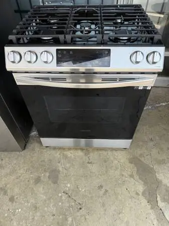 1 yr old black stainless steel gas stove and oven