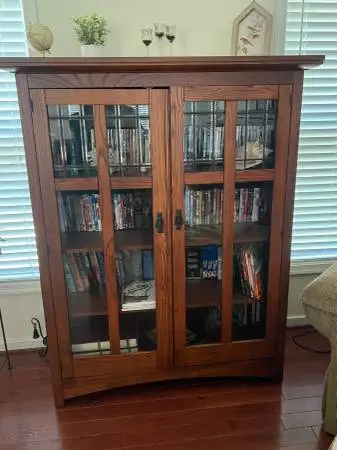 Bookcase and entertainment center with leaded glass doors