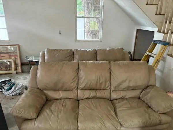 Two leather coach’s good shape selling due to construction project