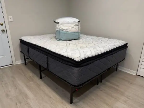 New queen size bed. Mattress, new frame, pillows & sheets. CAN DELIVER