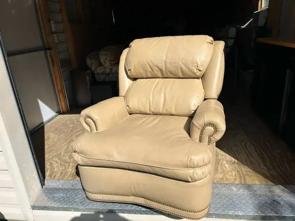 Tan leather recliner nailhead trim
