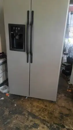 Side by side refrigerator 90 day warranty free local delivery