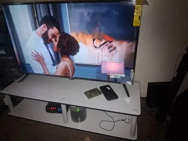 2 white tv stands