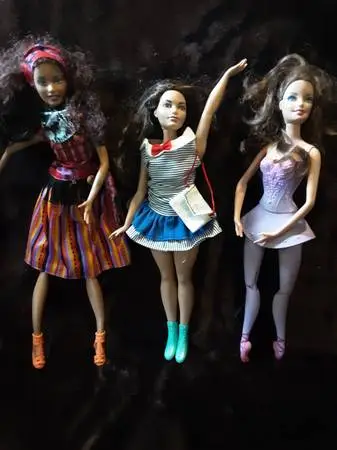 6 Barbie Dolls