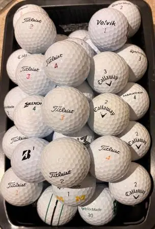 50 Golf Balls As Pictured Titleist , Taylormade, Callaway……..