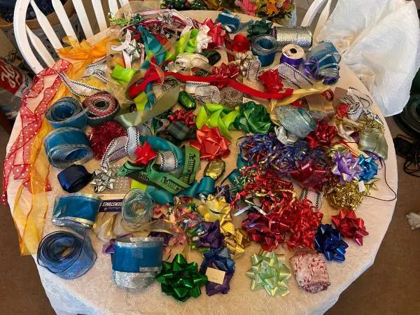 Large lot of gift giving ribbons & bows assorted sizes/ colors/styles.