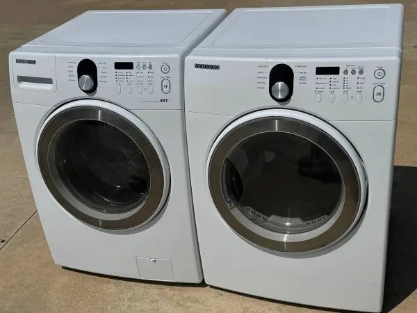 White color front load Samsung washer and dryer electric