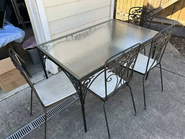 Wrought Iron patio set with glass top